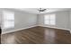 Bedroom featuring a ceiling fan, natural light, and hardwood floors at 5439 Cokesbury Rd, Fuquay Varina, NC 27526