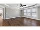 Spacious bedroom with wood floors, tray ceiling, and a ceiling fan at 5439 Cokesbury Rd, Fuquay Varina, NC 27526
