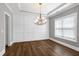 Traditional dining room features dark wood floors and paneled walls at 5439 Cokesbury Rd, Fuquay Varina, NC 27526