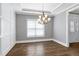 Formal dining room with elegant lighting and wainscoting at 5439 Cokesbury Rd, Fuquay Varina, NC 27526