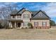 Charming two-story home featuring a well-maintained lawn, inviting curb appeal, and a classic design at 5439 Cokesbury Rd, Fuquay Varina, NC 27526