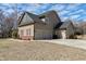 Attached three-car garage offering ample parking space with easy access to the home at 5439 Cokesbury Rd, Fuquay Varina, NC 27526