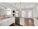Well-designed kitchen boasts stainless steel appliances and granite countertops at 5439 Cokesbury Rd, Fuquay Varina, NC 27526