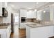 Kitchen features granite counters, stainless appliances, and white cabinets at 5439 Cokesbury Rd, Fuquay Varina, NC 27526
