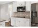 This modern kitchen is equipped with stainless appliances and granite countertops at 5439 Cokesbury Rd, Fuquay Varina, NC 27526