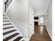 Bright living room showcasing hardwood floors, a fireplace, and plenty of natural light at 5439 Cokesbury Rd, Fuquay Varina, NC 27526