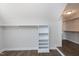 Walk-in closet with rods, shelves, and access to another closet at 5439 Cokesbury Rd, Fuquay Varina, NC 27526