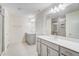 Bright bathroom features double vanities with white countertops, and a glass-enclosed shower at 6800 Franklin Heights Rd, Cary, NC 27518