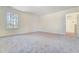Bedroom with plush carpeting, ample natural light and easy access to en suite bathroom at 6800 Franklin Heights Rd, Cary, NC 27518