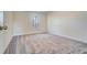 Bright bedroom featuring neutral walls, plush carpet flooring, and a window offering natural light at 6800 Franklin Heights Rd, Cary, NC 27518