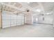 Spacious two car garage featuring concrete flooring, two garage doors and drywall at 6800 Franklin Heights Rd, Cary, NC 27518