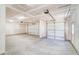 Spacious three car garage featuring concrete flooring, drywall and three garage doors at 6800 Franklin Heights Rd, Cary, NC 27518