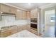 The lovely kitchen features stainless appliances, light countertops, and modern cabinetry at 6800 Franklin Heights Rd, Cary, NC 27518