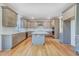 Spacious kitchen with stainless steel appliances, large island, and gorgeous countertops at 6800 Franklin Heights Rd, Cary, NC 27518