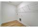 Laundry room with vinyl floor and wire shelving at 6800 Franklin Heights Rd, Cary, NC 27518
