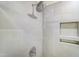 Shower features white tile surround and a rainfall shower head at 6800 Franklin Heights Rd, Cary, NC 27518
