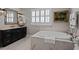 Bathroom featuring a soaking tub and modern fixtures at 809 Wayne Dr, Raleigh, NC 27608