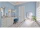 Relaxing bathroom featuring a vanity, makeup table, chandelier and soaking tub for ultimate comfort and style at 809 Wayne Dr, Raleigh, NC 27608