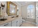 Stylish bathroom with a window, a framed mirror, and a neutral color palette at 809 Wayne Dr, Raleigh, NC 27608