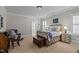 Bedroom featuring a decorative bed frame, hardwood floors and an adjoining room at 809 Wayne Dr, Raleigh, NC 27608