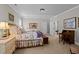 Bedroom featuring a decorative bed frame and an adjoining room at 809 Wayne Dr, Raleigh, NC 27608
