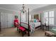 Bedroom with a four poster bed and neutral decor at 809 Wayne Dr, Raleigh, NC 27608