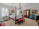 Bedroom with a four poster bed, vintage furniture, and ample natural light at 809 Wayne Dr, Raleigh, NC 27608