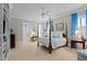 Comfortable bedroom with a four-poster bed, soft blue accents, and ample natural light at 809 Wayne Dr, Raleigh, NC 27608