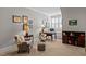 Sitting room with a desk, plush furnishings and natural light at 809 Wayne Dr, Raleigh, NC 27608