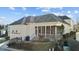 Home exterior with a screened porch, brick stairs, and a well-maintained black fence at 809 Wayne Dr, Raleigh, NC 27608