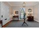 Elegant foyer featuring decorative wallpaper, stained glass window, hardwood flooring, and chandelier at 809 Wayne Dr, Raleigh, NC 27608