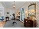Elegant foyer featuring decorative wallpaper, stained glass window, and hardwood flooring at 809 Wayne Dr, Raleigh, NC 27608
