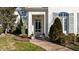 Inviting front entrance featuring a brick pathway and an elegant glass paneled front door at 809 Wayne Dr, Raleigh, NC 27608