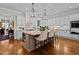 Bright kitchen with large island, bar stools, and modern lighting at 809 Wayne Dr, Raleigh, NC 27608