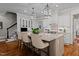 Modern kitchen with large center island, stove and custom tile backsplash at 809 Wayne Dr, Raleigh, NC 27608