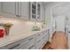 Kitchen features marble countertops and custom cabinets at 809 Wayne Dr, Raleigh, NC 27608
