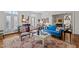 Bright living room with hardwood floors, stylish furniture, and large windows with plantation shutters at 809 Wayne Dr, Raleigh, NC 27608