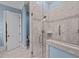 Modern walk-in shower with marble tile and glass door at 809 Wayne Dr, Raleigh, NC 27608