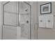 Walk-in shower with marble tiles and a seamless glass enclosure at 809 Wayne Dr, Raleigh, NC 27608