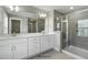 Elegant bathroom featuring double vanity, modern fixtures, and a glass-enclosed shower at 73 Merle Dr, Wendell, NC 27591