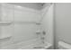 Clean bathroom shower/tub with built-in shelves and a neutral color scheme at 54 Merle Dr, Wendell, NC 27591