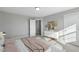 Bedroom with a plush bed, modern dresser, and ample natural light for a cozy retreat at 54 Merle Dr, Wendell, NC 27591