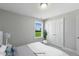 Bright bedroom with a view of the yard, closet, and light gray walls at 73 Merle Dr, Wendell, NC 27591