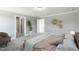 Spacious bedroom featuring neutral tones, plush carpeting, and modern wall art at 73 Merle Dr, Wendell, NC 27591