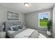 Cozy bedroom with bright window view, neutral decor, and comfortable furnishings at 73 Merle Dr, Wendell, NC 27591