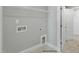 Practical laundry room with shelving, utility connections, and a nearby door for easy access at 54 Merle Dr, Wendell, NC 27591