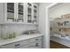 A large pantry with white cabinets and drawers provides ample storage, complemented by a spacious, organized walk-in at 73 Merle Dr, Wendell, NC 27591