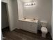 Bright bathroom features double vanity and toilet at 102 Sue Ave, Dunn, NC 28334
