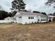 Charming single-story home with attached garage, light-colored siding and a well-maintained lawn at 102 Sue Ave, Dunn, NC 28334