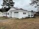 Charming single-story home with attached garage, light-colored siding and a well-maintained lawn at 102 Sue Ave, Dunn, NC 28334